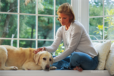 Women comforting her dog