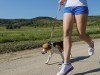 Girl jogging with her dog 