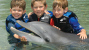 kids with a dolphin