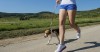 Girl jogging with her dog 